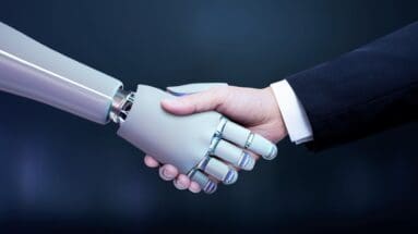 robot hand and human hand shaking